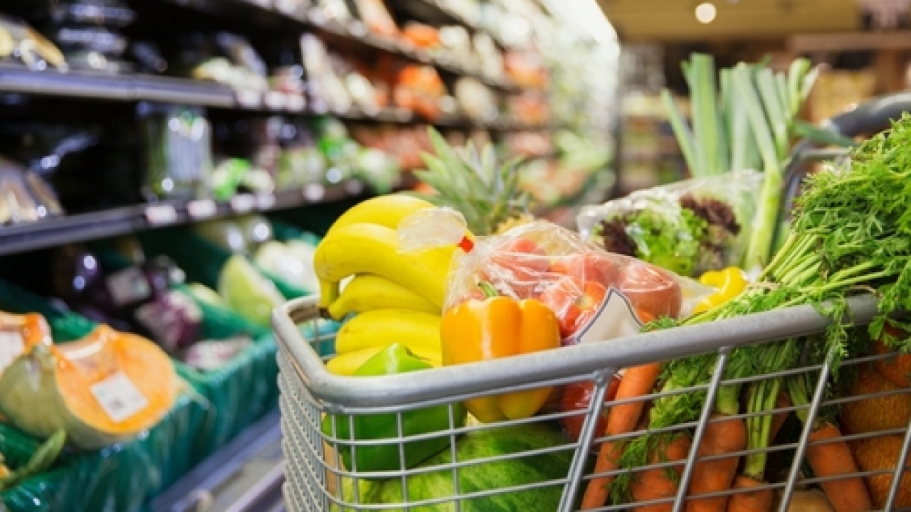 Stock image of a full grocery cart.