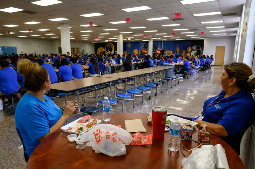 Bonham Middle School employees watch as students begin to gather for lunch in the school’s cafeteria on Sept. 13, 2023 in Odessa..png