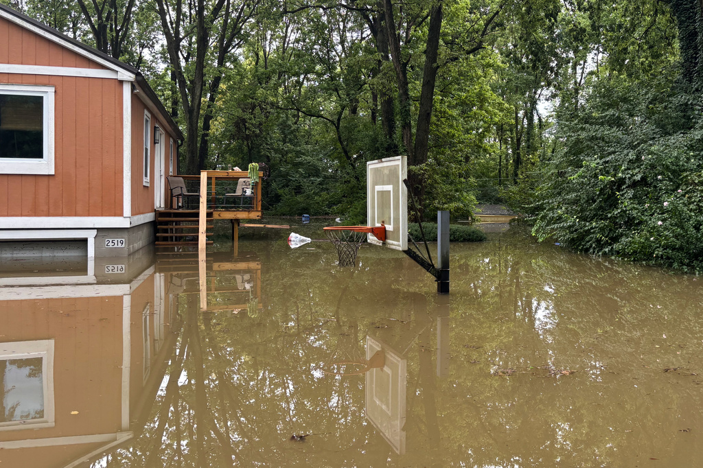 This photo provided by the Indianapolis Fire Department shows flooding in northern Indianapolis, Ind., Saturday, Aug. 15, 2026.