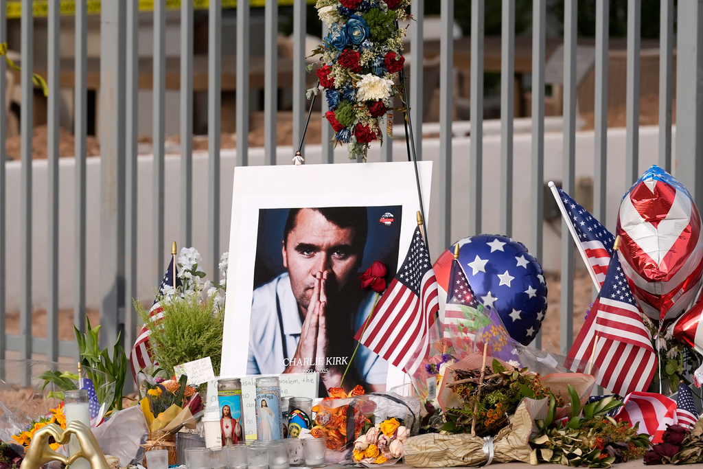 A makeshift memorial grows in size at the Turning Point USA headquarters after the shooting death at a Utah college of Charlie Kirk, the 31-year-old founder and CEO of the organization, Sept. 17, 2025, in Phoenix.