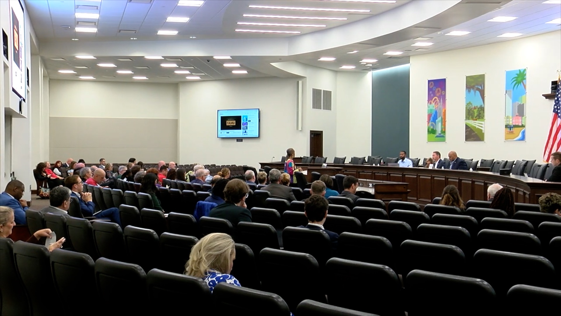 Interior of the Knoxx Building as a neighbor talks to lawmakers