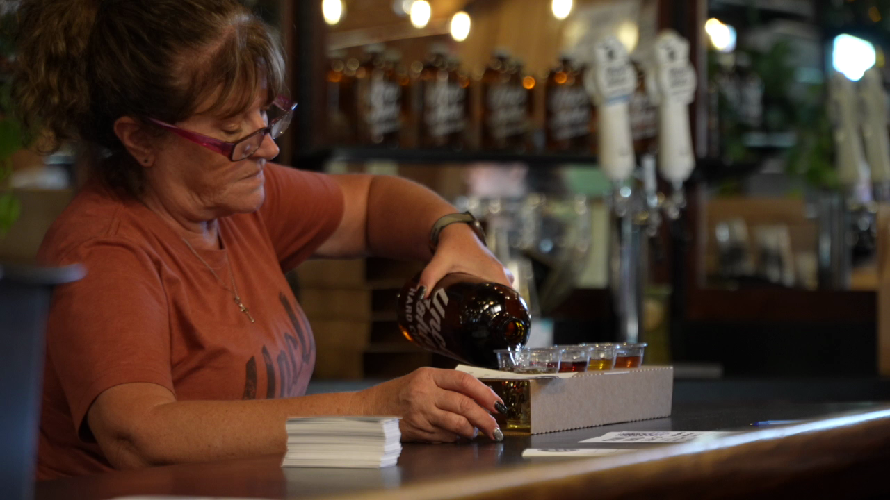 Drinks being poured in the Uncle Johns Cider Mill taproom