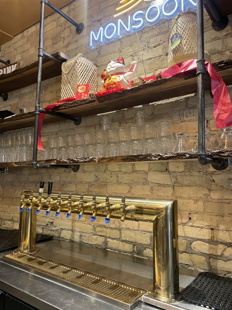 Empty beer taps and an empty bar at Monsoon before the restaurant received their liquor license