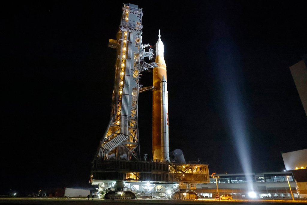 The NASA Artemis II rocket with the Orion spacecraft aboard leaves the Vehicle Assembly Building moving slowly to pad 39B at the Kennedy Space Center in Cape Canaveral, Fla., Friday, March 20, 2026. 