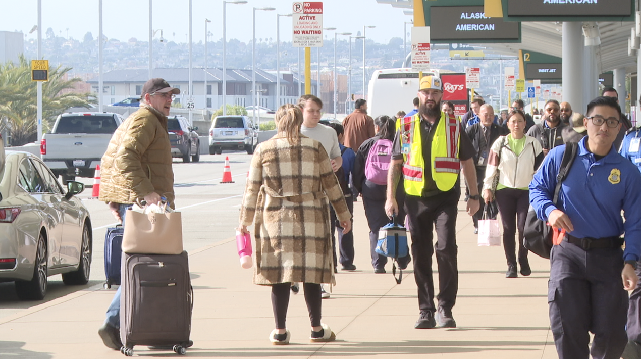 Travelers going through the airport on Sunday, November 30th. 