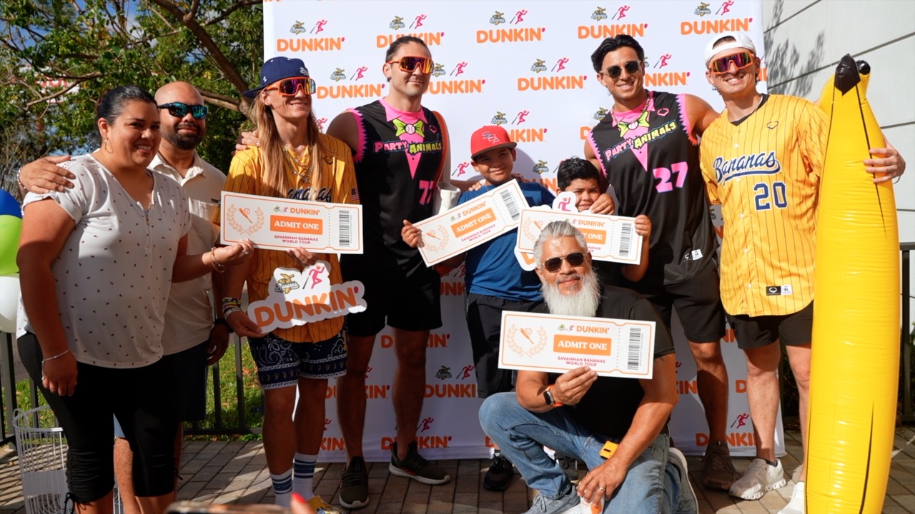 Raul Diaz and his family with the Savannah Bananas and the Party Animals