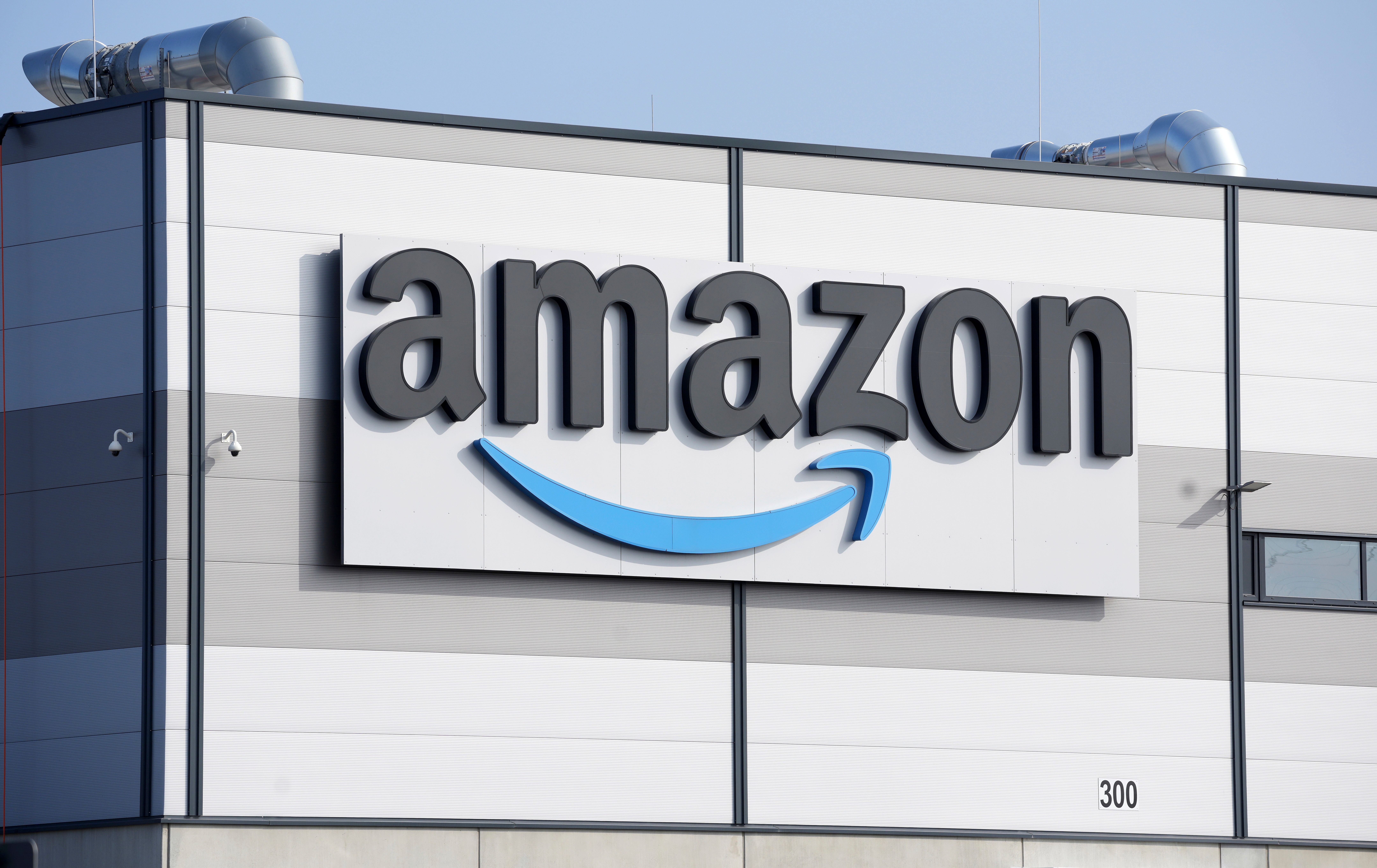 FILE - An Amazon company logo marks the facade of a building, March 18, 2022, in Schoenefeld near Berlin.