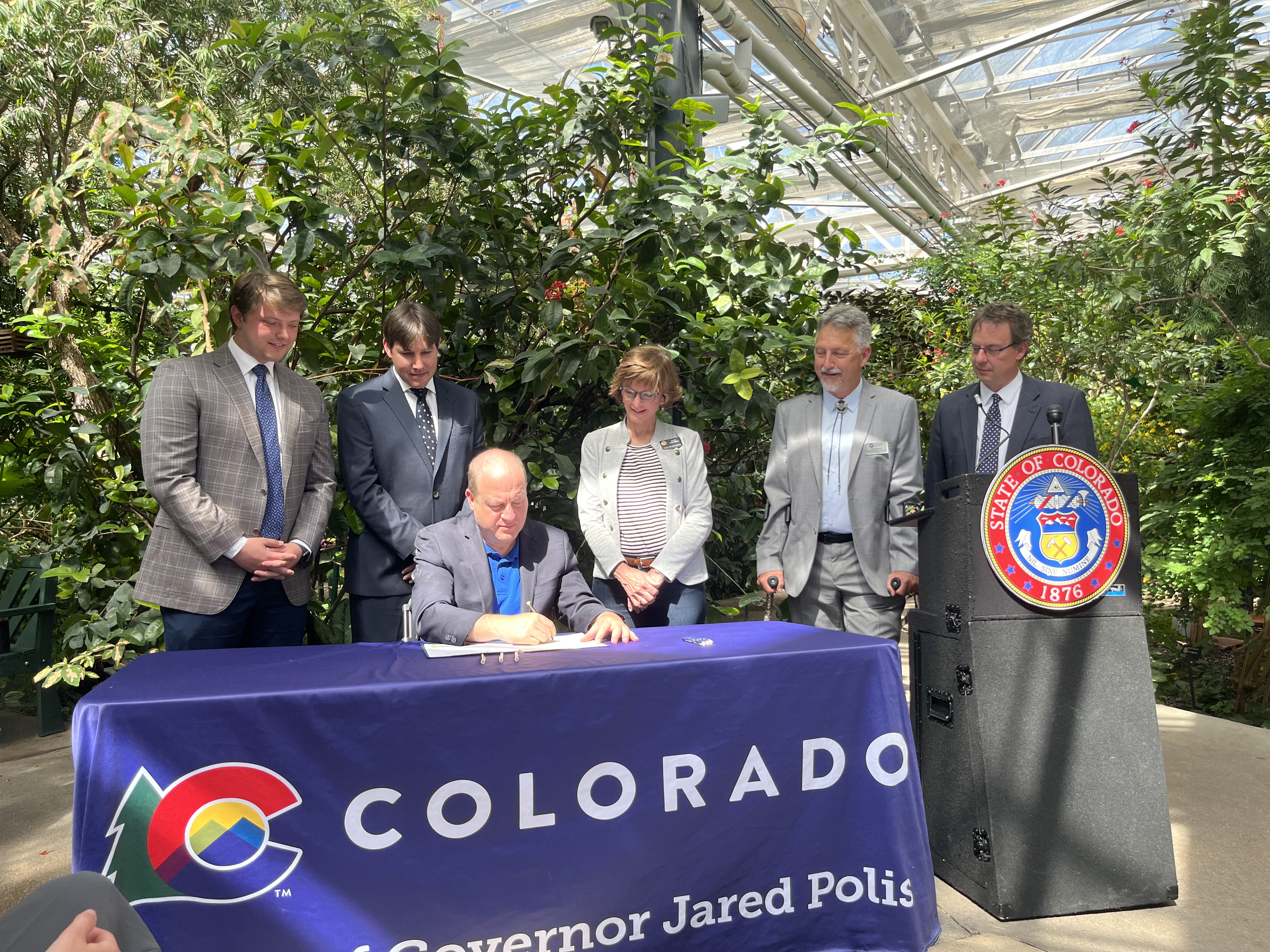 Jared Polis signs invertebrate bill at Butterfly Pavilion
