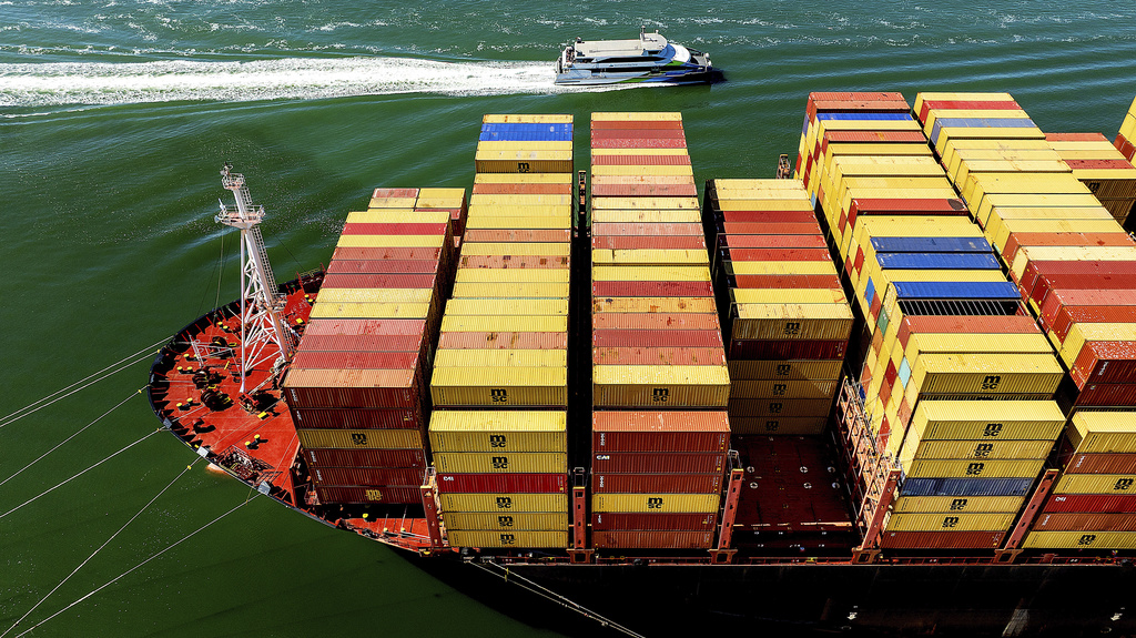 Cargo containers fill a ship at the Port of Oakland.