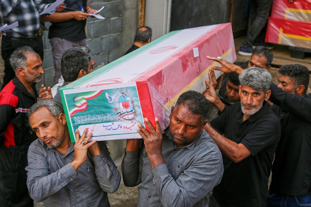 A coffin is carried during the funeral of mostly children killed in a strike Feb. 28 at a girls' elementary school in Minab, Iran, Tuesday, March 3, 2026.