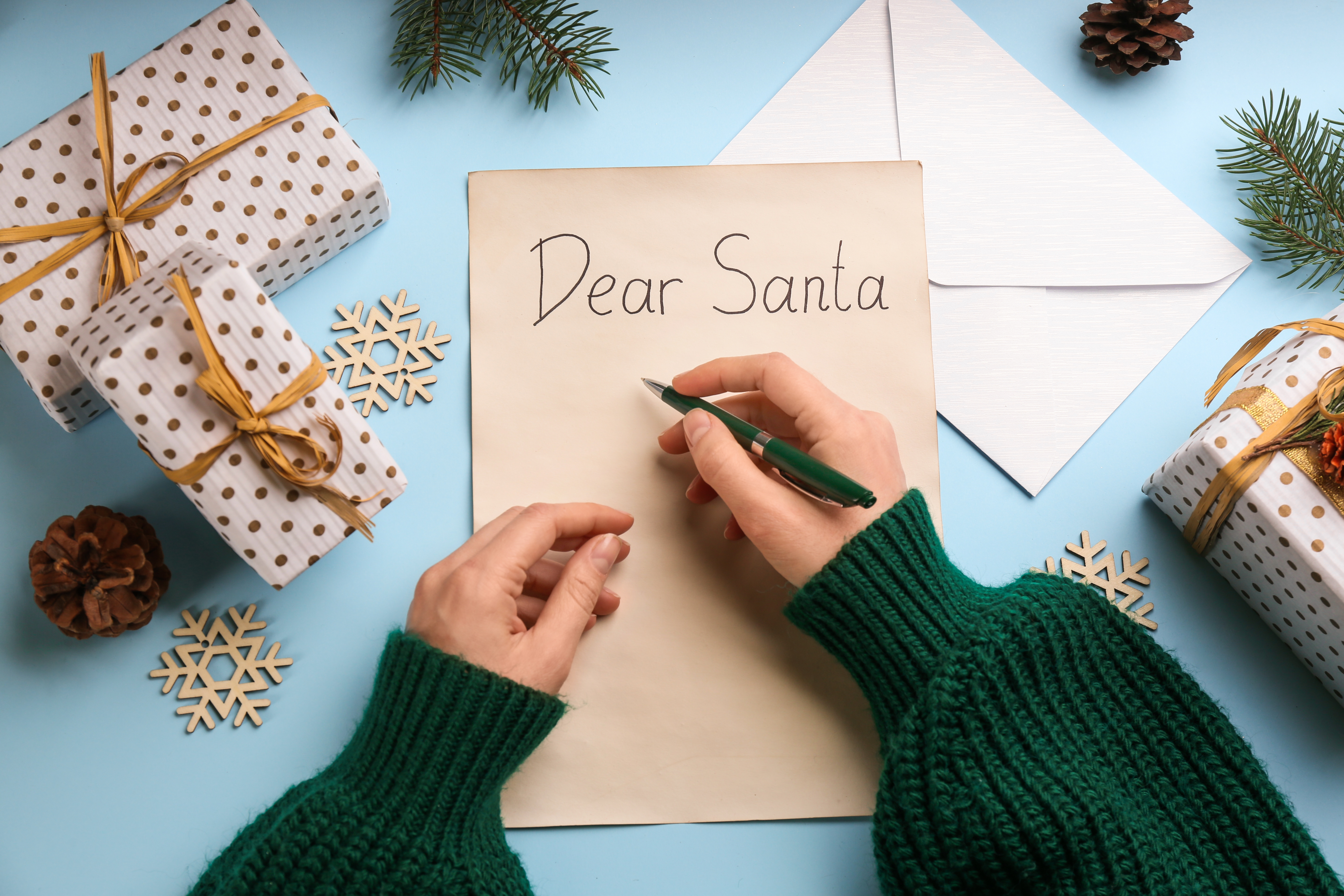 A person writes a letter to Santa.