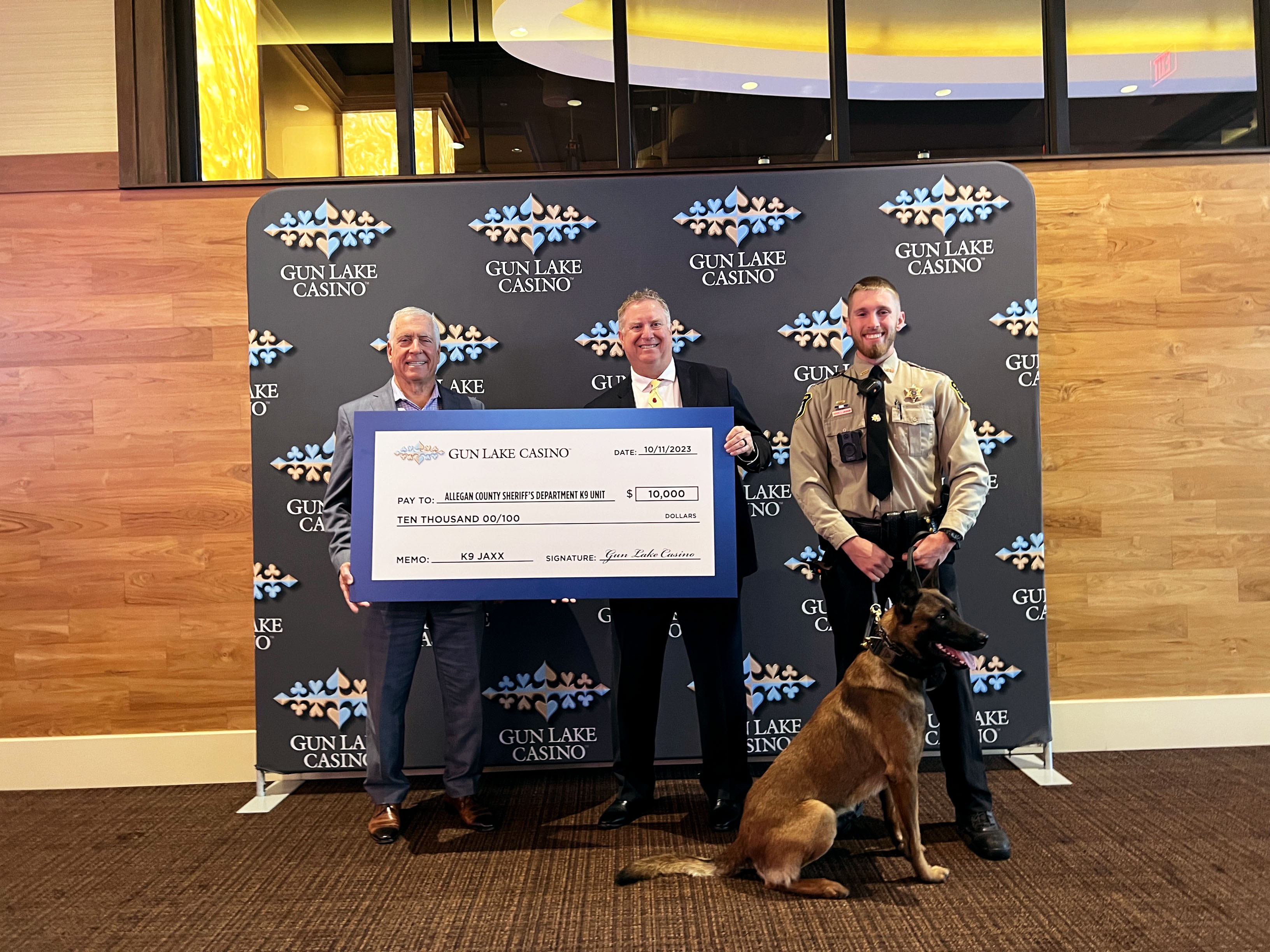 Left to right, Sal Semola – Gun Lake Casino CEO, Frank Baker - Allegan County Sheriff, Tyler Jackson – Allegan County K9 Handler Deputy, Jaxx.png