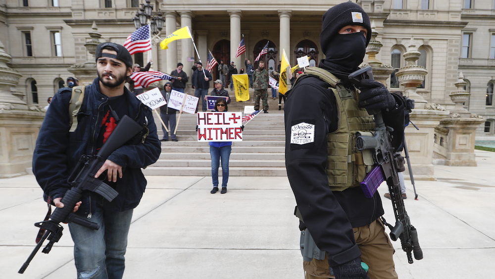 Michigan governor extends state of emergency as armed protesters call for state to reopen