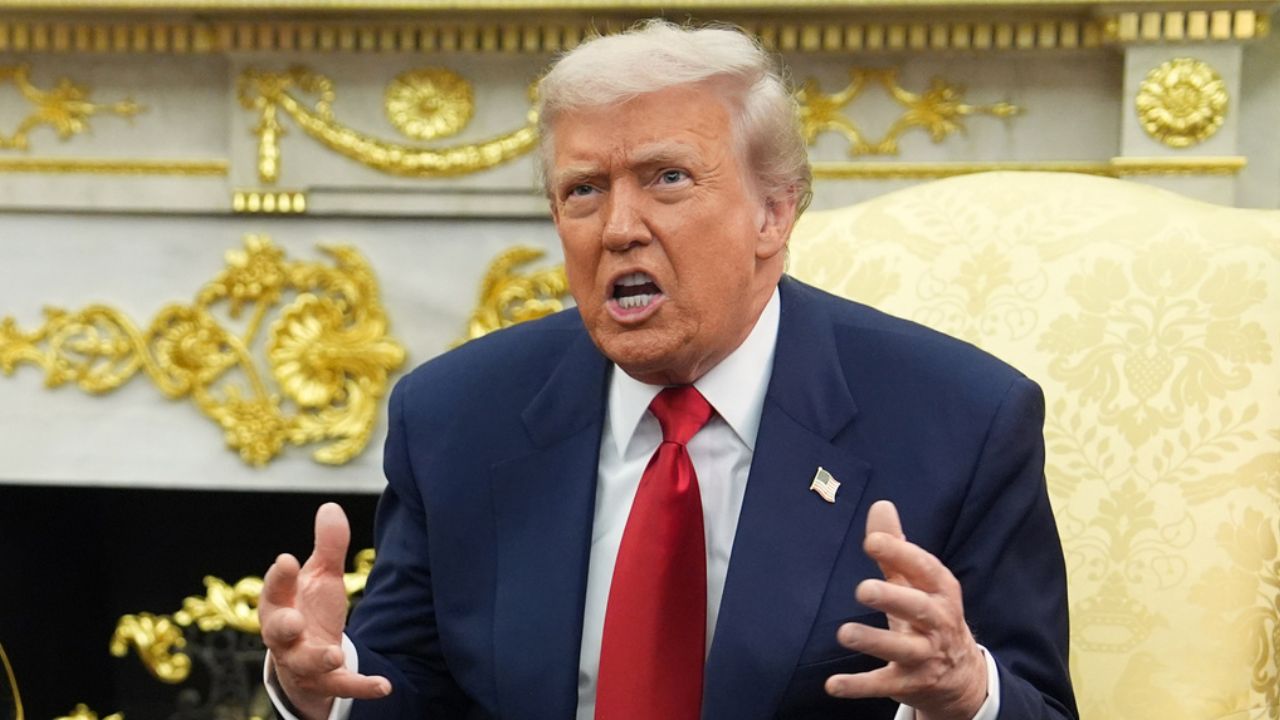 President Trump appears animated during an exchange with reporters in the White House. 