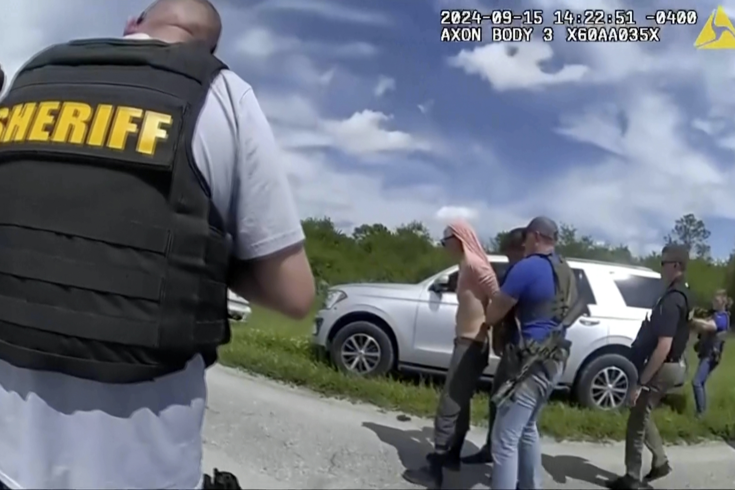 FILE - In this image taken from police body camera video and released by the Martin County, Fla., Sheriff's Office, law enforcement officers arrest Ryan Routh, the man suspected in the apparent assassination attempt of Donald Trump, Sunday, Sept. 15, 2024. 