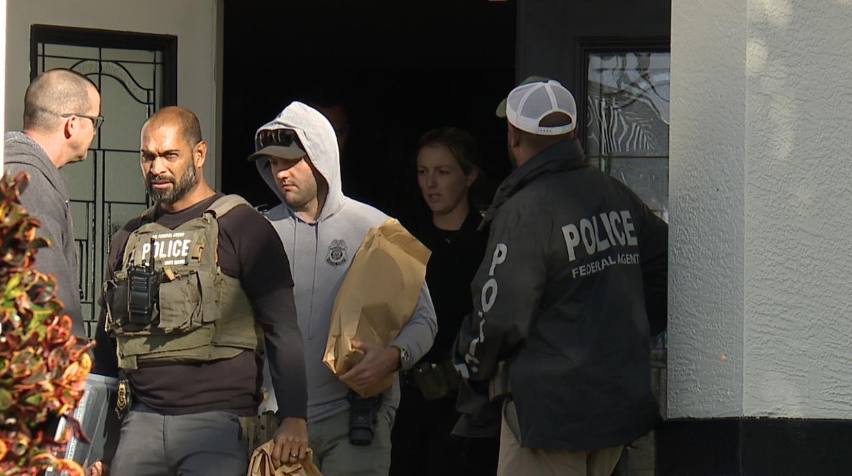 Law enforcement walking away from the home 