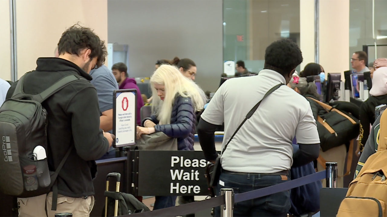 Travelers get screened at Palm Beach International Airport on Jan. 2, 2026.