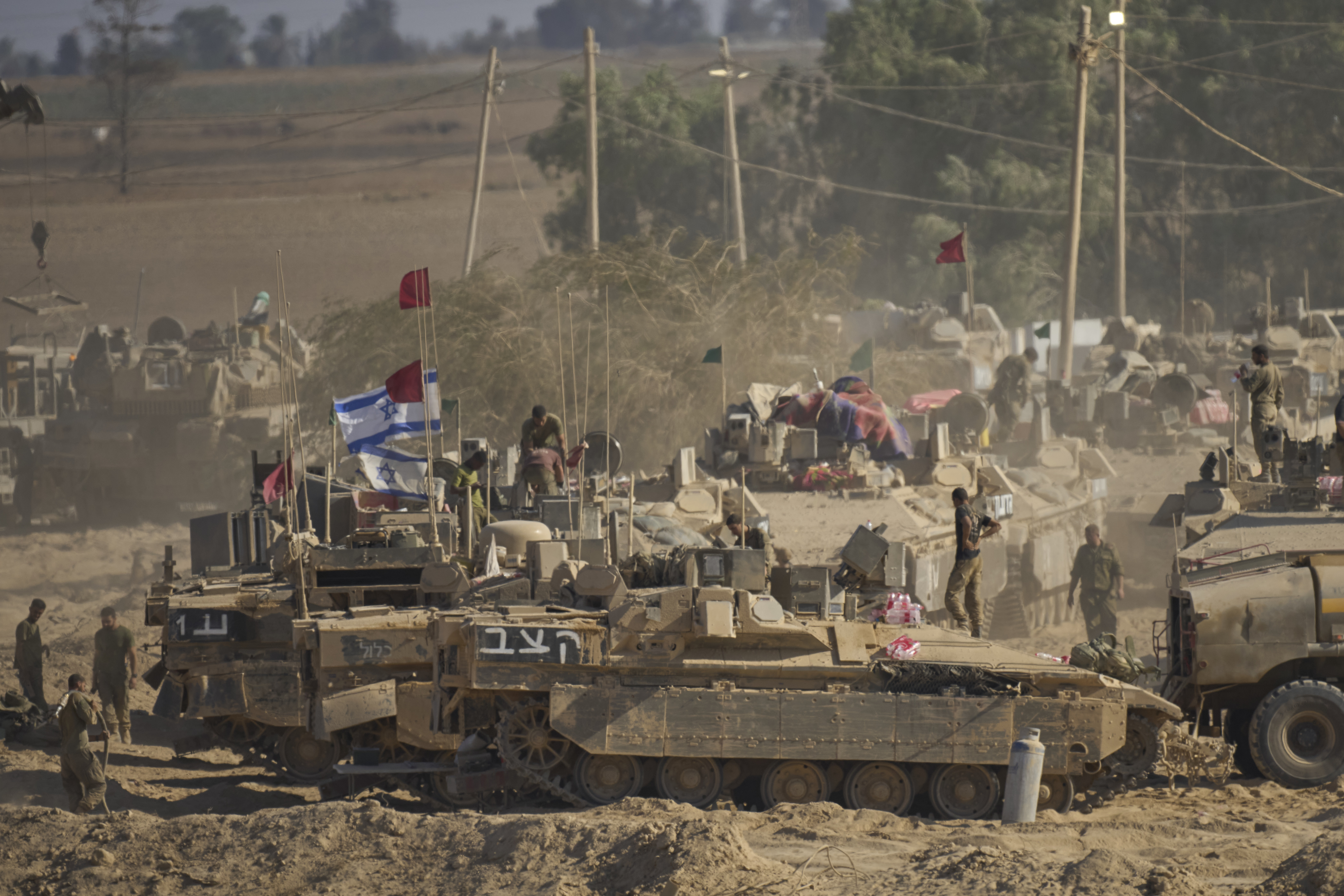 Israeli soldiers are seen near the Gaza Strip border in southern Israel, Wednesday, Aug. 6, 2025. 