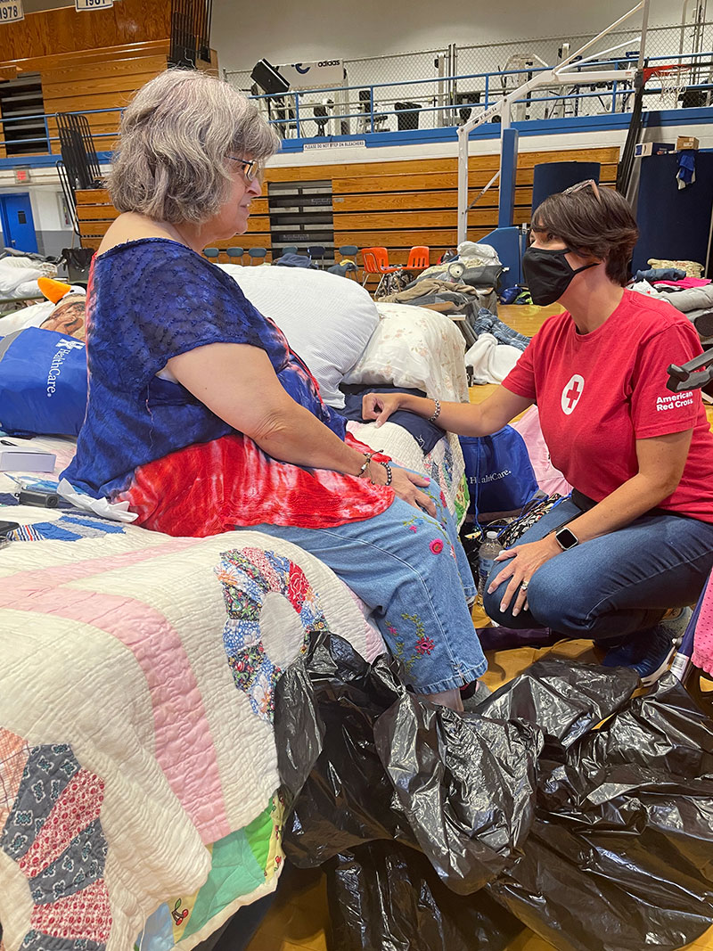Red Crosser speaks with Kentucky resident at the shelter
