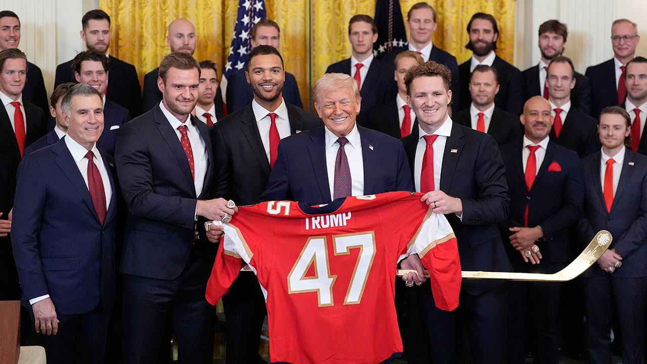 President Donald Trump poses for a photo during an event to honor the 2025 Stanley Cup Champion Florida Panthers in the East Room of the White House, Thursday, Jan. 15, 2026, in Washington. 