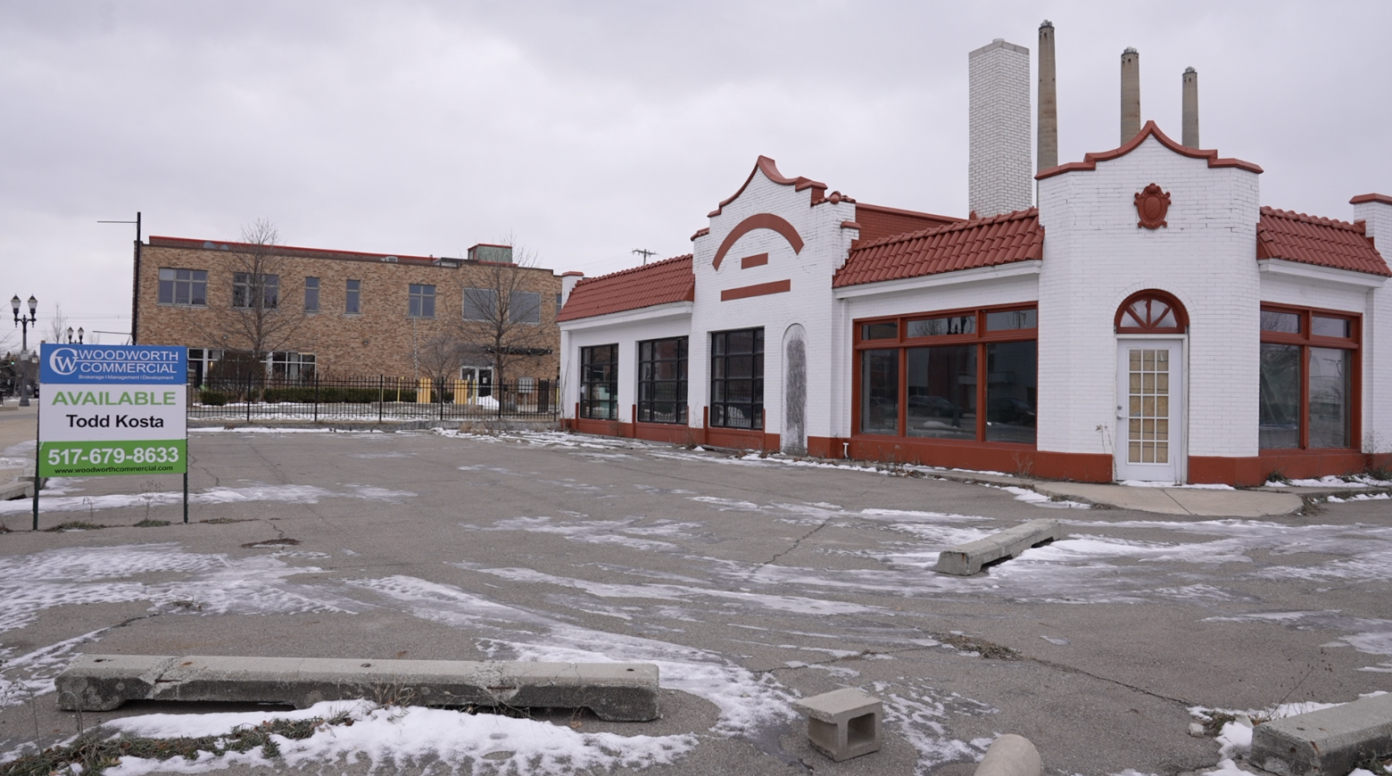 Food trucks and indoor-outdoor bar could replace this former gas station in REO Town