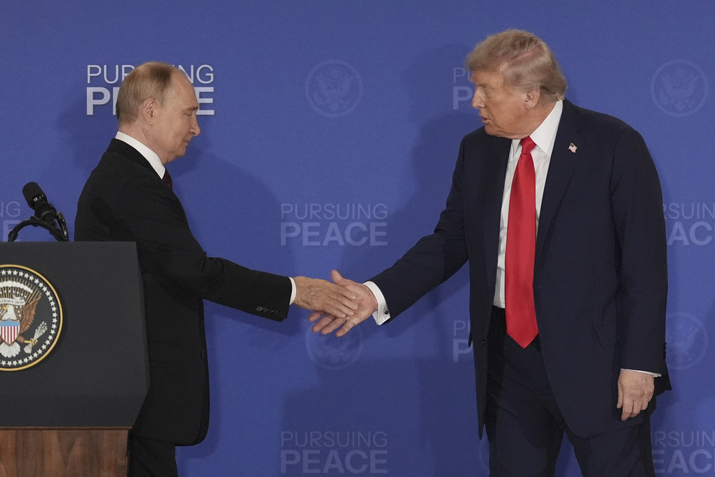 President Donald Trump, right, shakes the hand of Russia's President Vladimir Putin during a joint press conference at Joint Base Elmendorf-Richardson, Alaska, Aug. 15, 2025. 