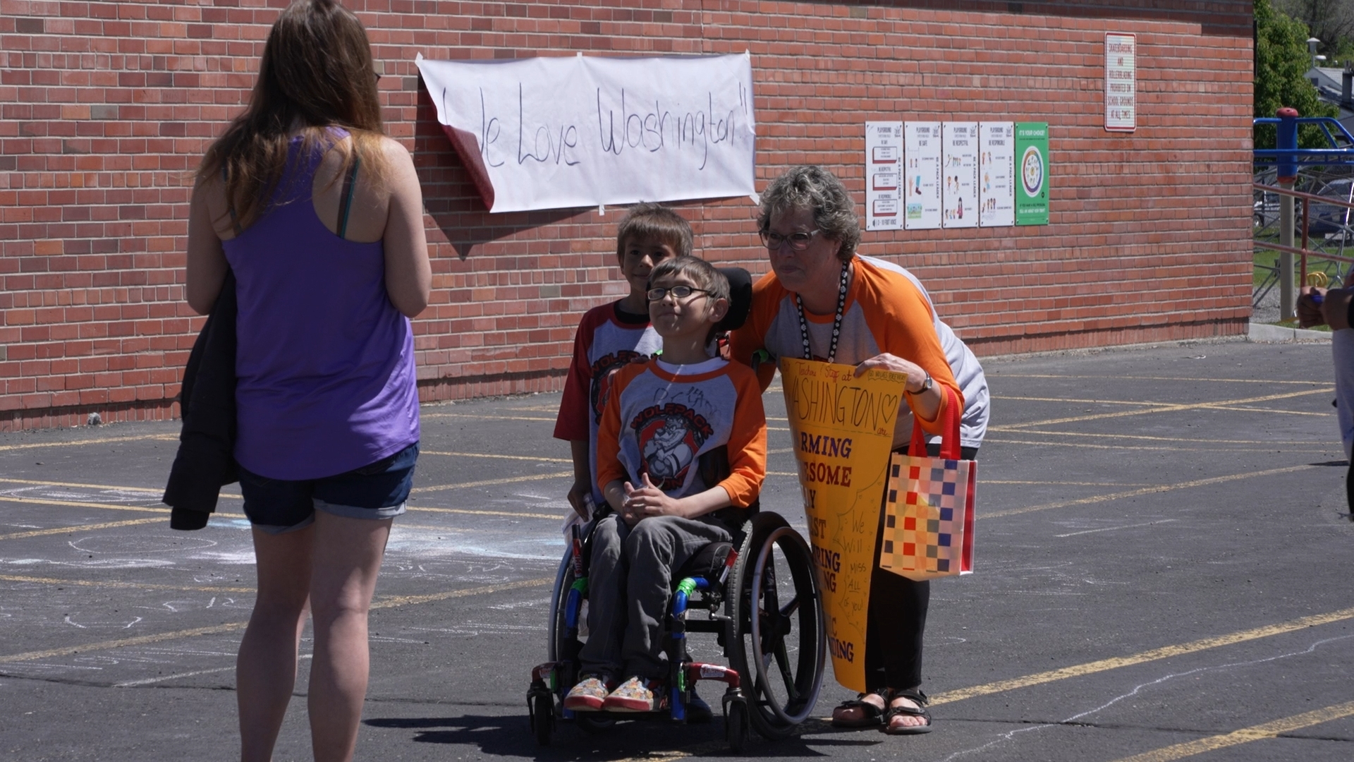 Julie Wilkinson posing for photos with students