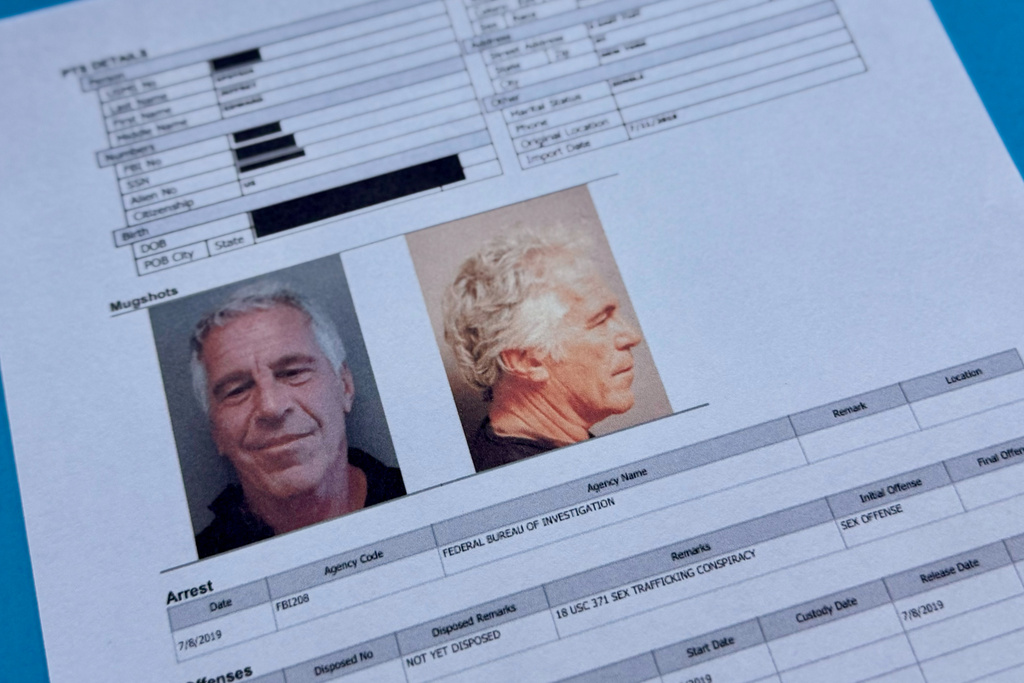 Documents that were included in the U.S. Department of Justice release of the Jeffrey Epstein files are photographed Friday, Jan. 2, 2026. 