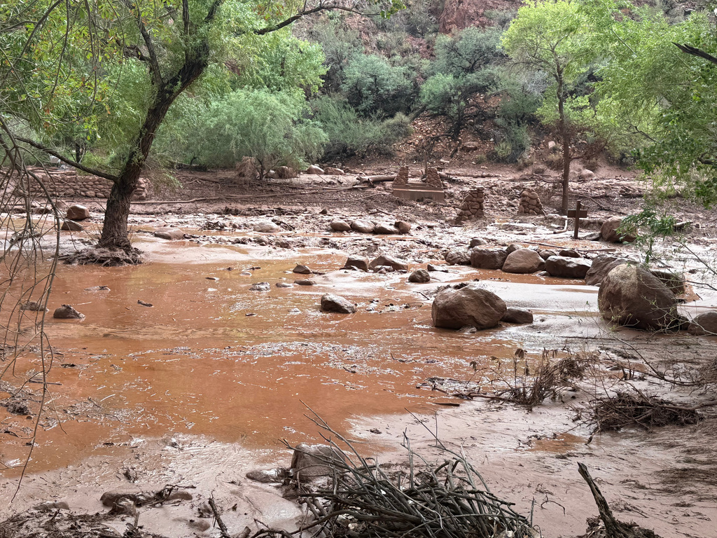 This photo provided by the National Park Service shows remnants of stone bridge pylons along Bright Angel Creek in the Grand Canyon following a flash flood that destroyed the footbridge, Saturday, Aug. 29, 2026.