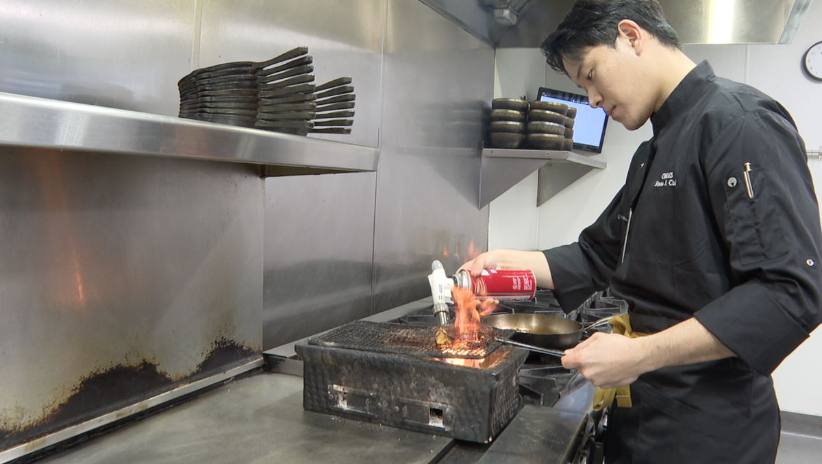 Chef Jiwoo Choi making the charred gochujang octopus. 
