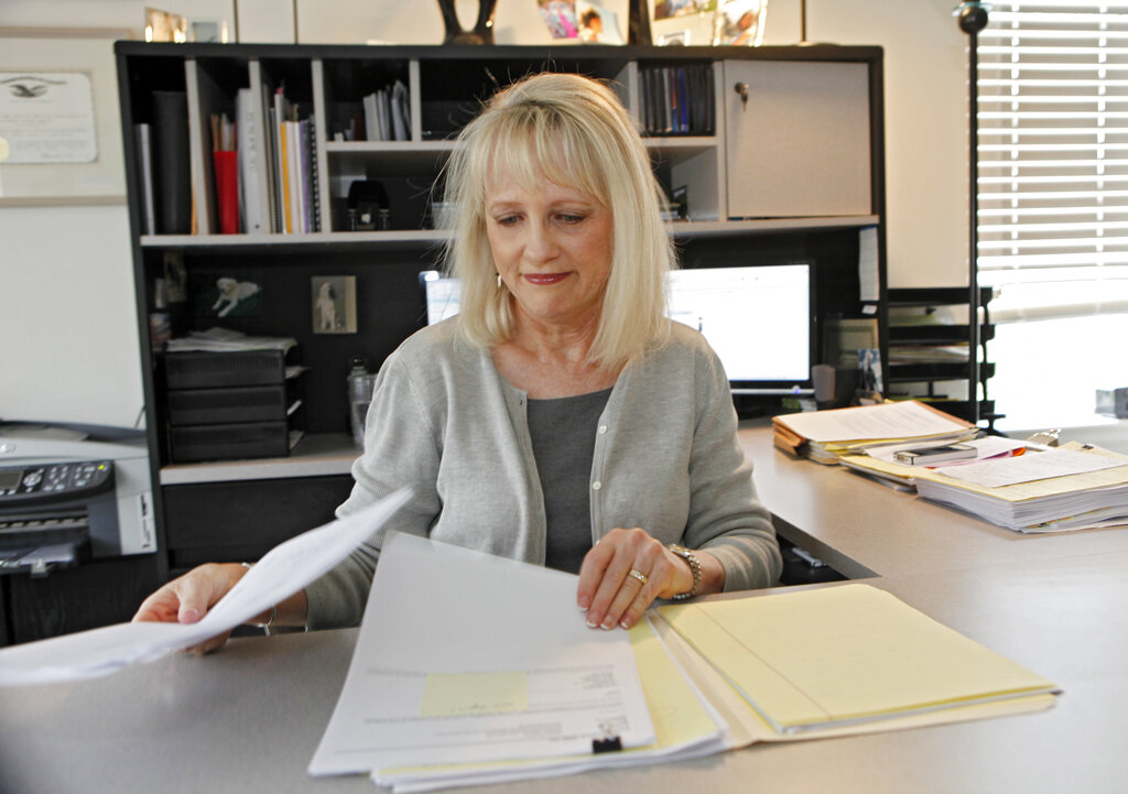 Woman Working Behind Desk