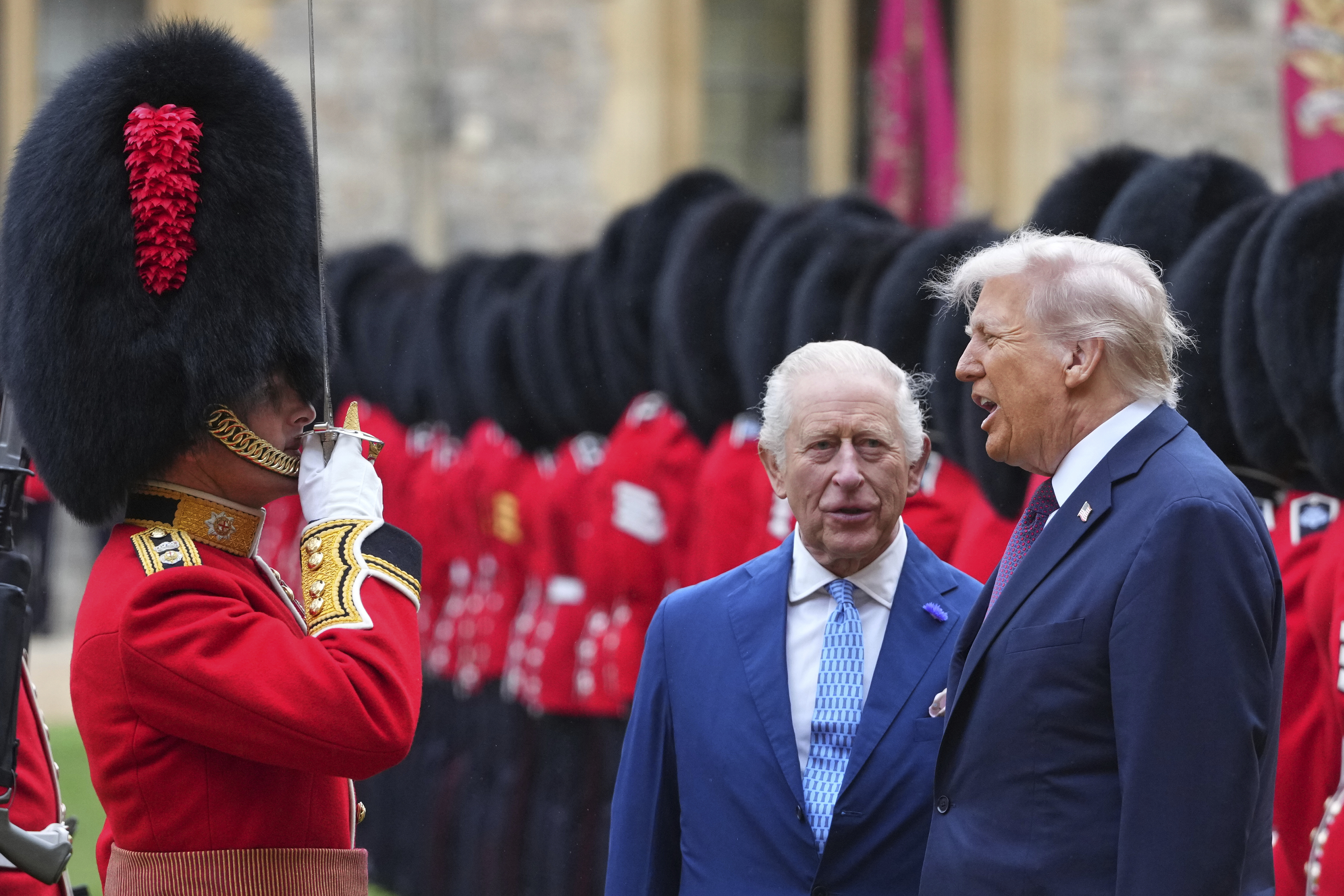 President Donald Trump and Britain's King Charles III review the Guard of Honour after the arrival at Windsor Castle in Windsor, England, Wednesday, Sept. 17, 2025.