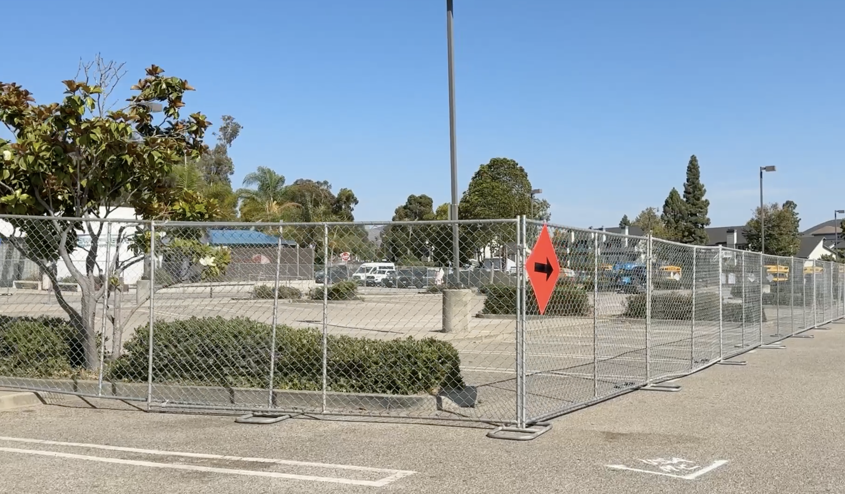 Construction fencing is up around the entire center section of the parking lot at SLO Swim Center, adjacent to the baseball stadium, just past the SLO YMCA