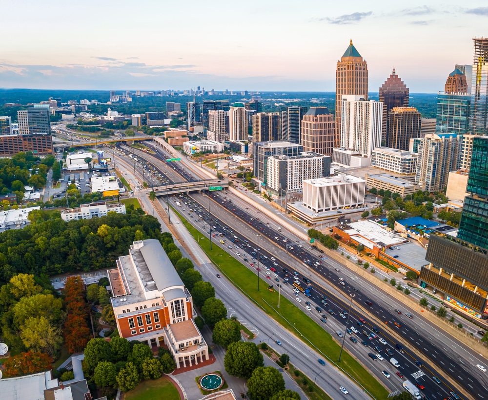 Atlanta,Skyline,And,Highway,At,Sunset,With,Midtown,Towers,And