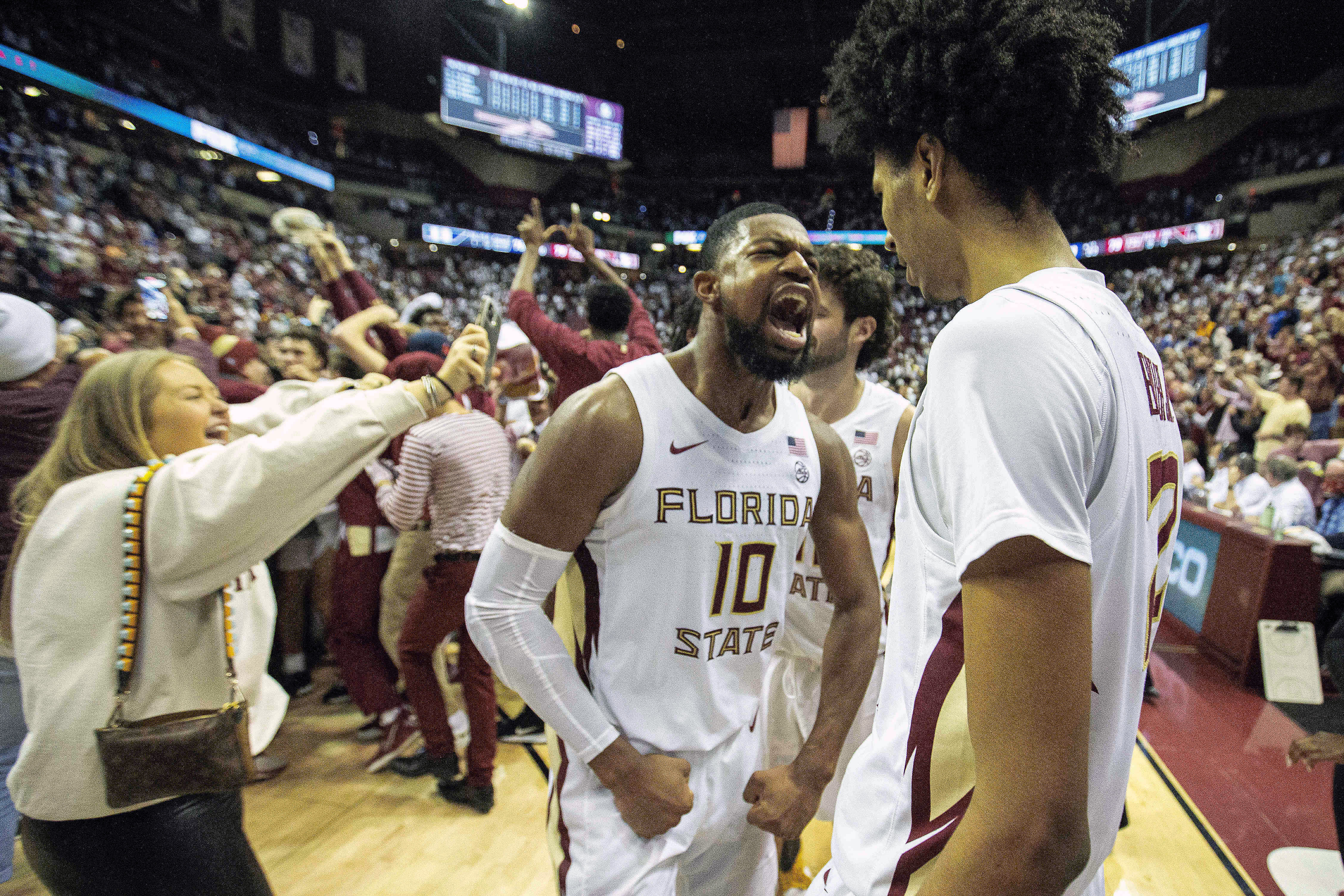 Florida State Seminoles forwards Malik Osborne and John Butler celebrate after beating Duke Blue Devils, Jan. 18, 2022