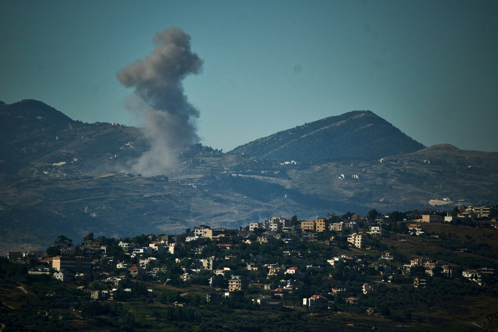 Smoke rises to the sky following an Israeli military strike in southern Lebanon as seen from northern Israel, Friday, June 19, 2026. 