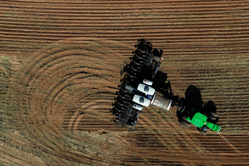 A seeder is pulled by tractor to plant soy on the Morada do Sol farm in Santa Cruz do Rio Pardo, Sao Paulo state, Brazil, Oct. 15, 2025.