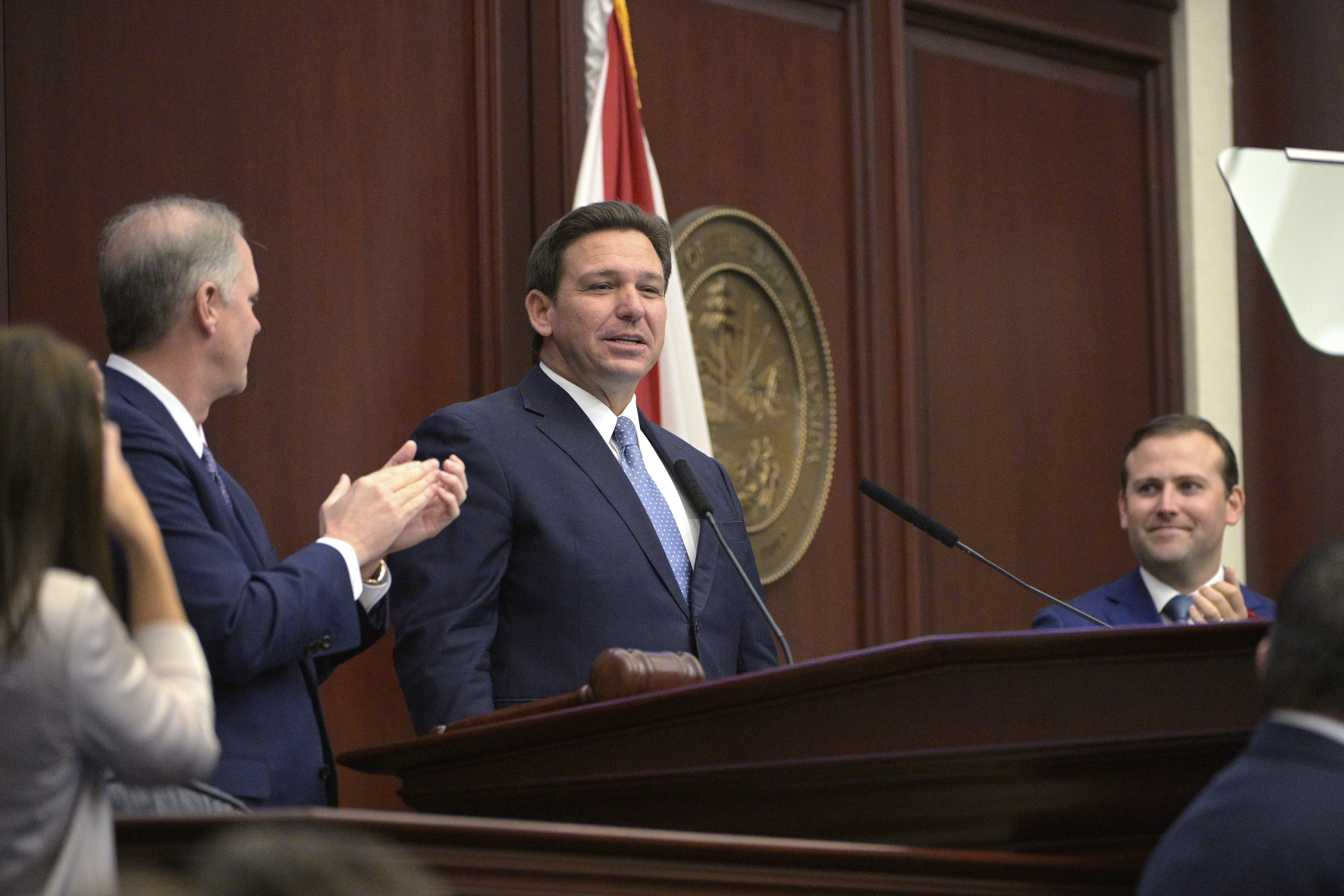 Florida Senate Preisdent Wilton Simpson and House Speaker Chris Sprowls applaud Gov. Ron DeSantis, Jan. 11, 2022