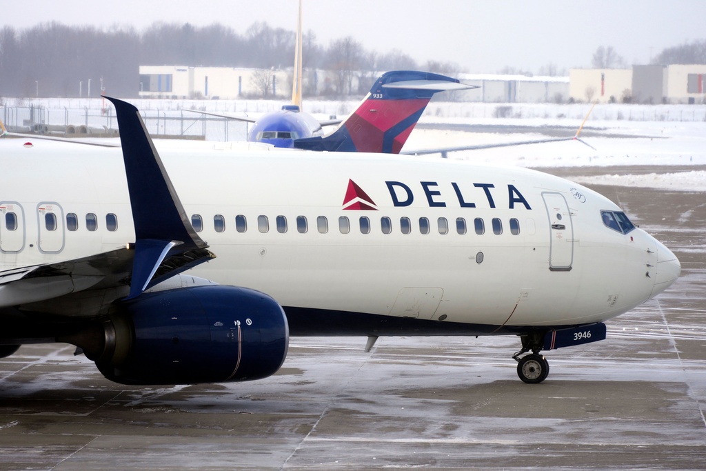 A Delta Airlines jet pulls away from a gate at Pittsburgh International Airport in Imperial, Pa., Saturday, Feb. 7, 2026. 