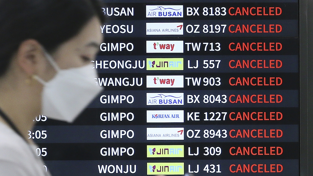 Signboard shows canceled flights.