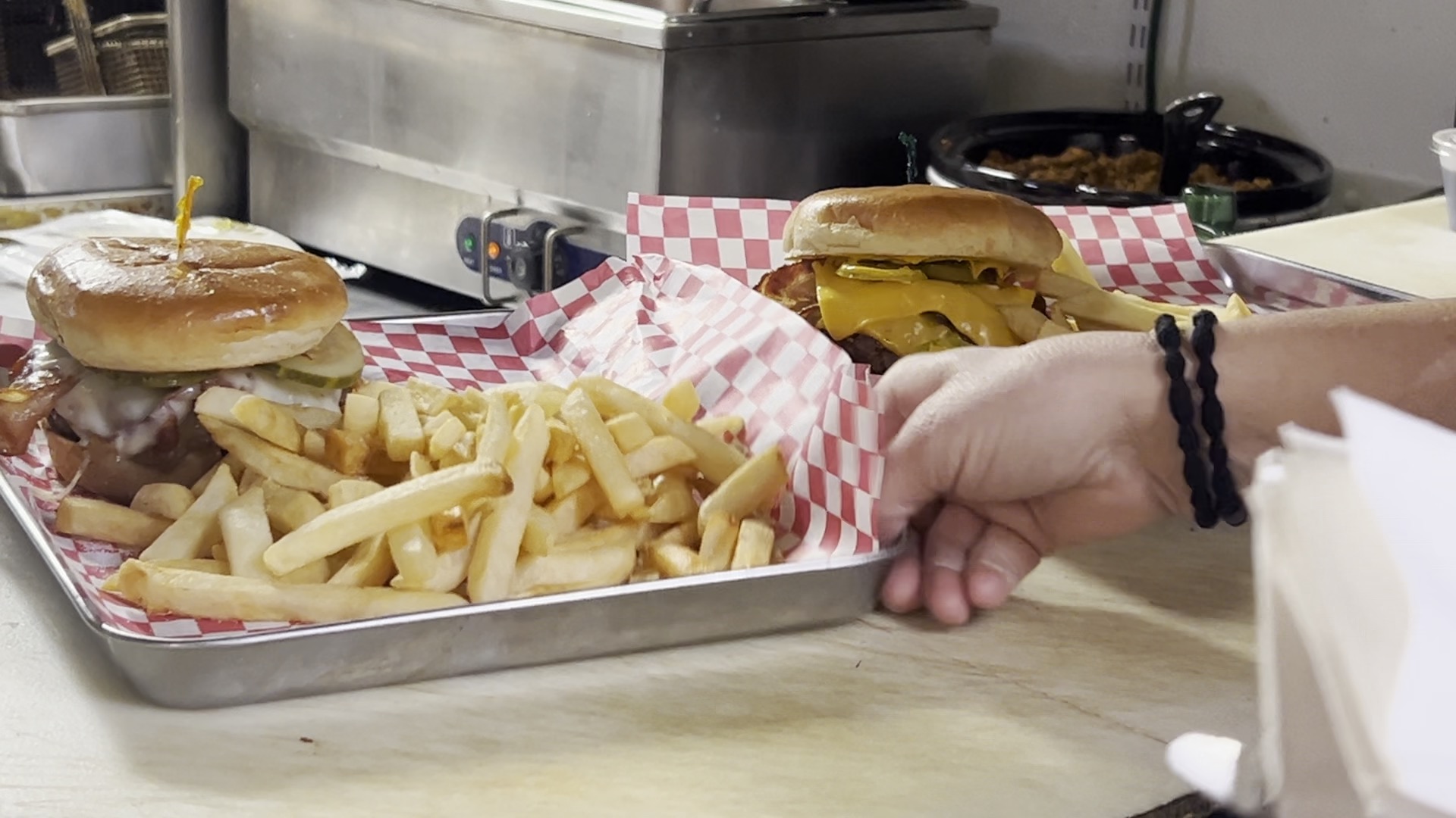 Server grabs burgers at Archey's Bar & Grill in Onondaga