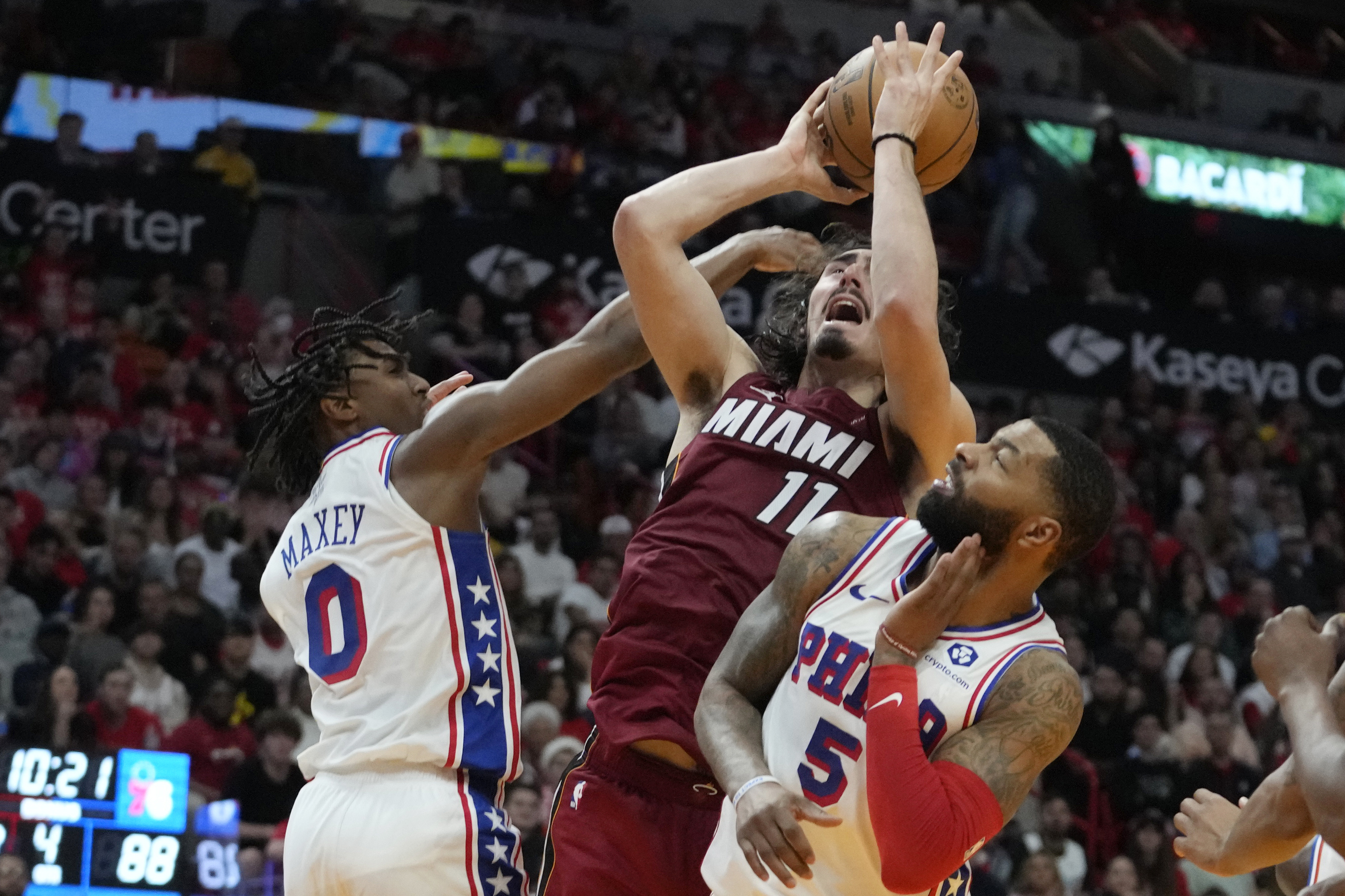 Miami Heat guard Jaime Jaquez Jr. fouled by Philadelphia 76ers guard Tyrese Maxey during second half, Dec. 25, 2023