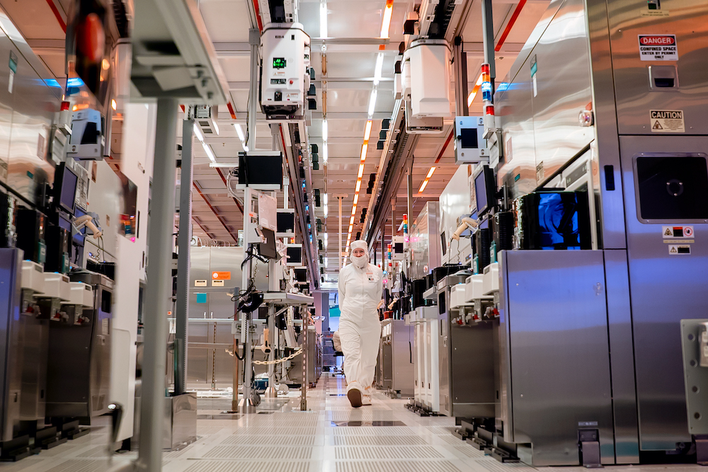 Margaret Henschel, one of the more than 50,000 Intel employees in the United States, moves through Fab 32, a high-volume manufacturing facility in Chandler, Arizona. Intel Corporation’s U.S. manufacturing and research and development facilities are in Oregon, Arizona and New Mexico. They operate 24 hours a day, 365 days a year. (Credit: Tim Herman/Intel Corporation)