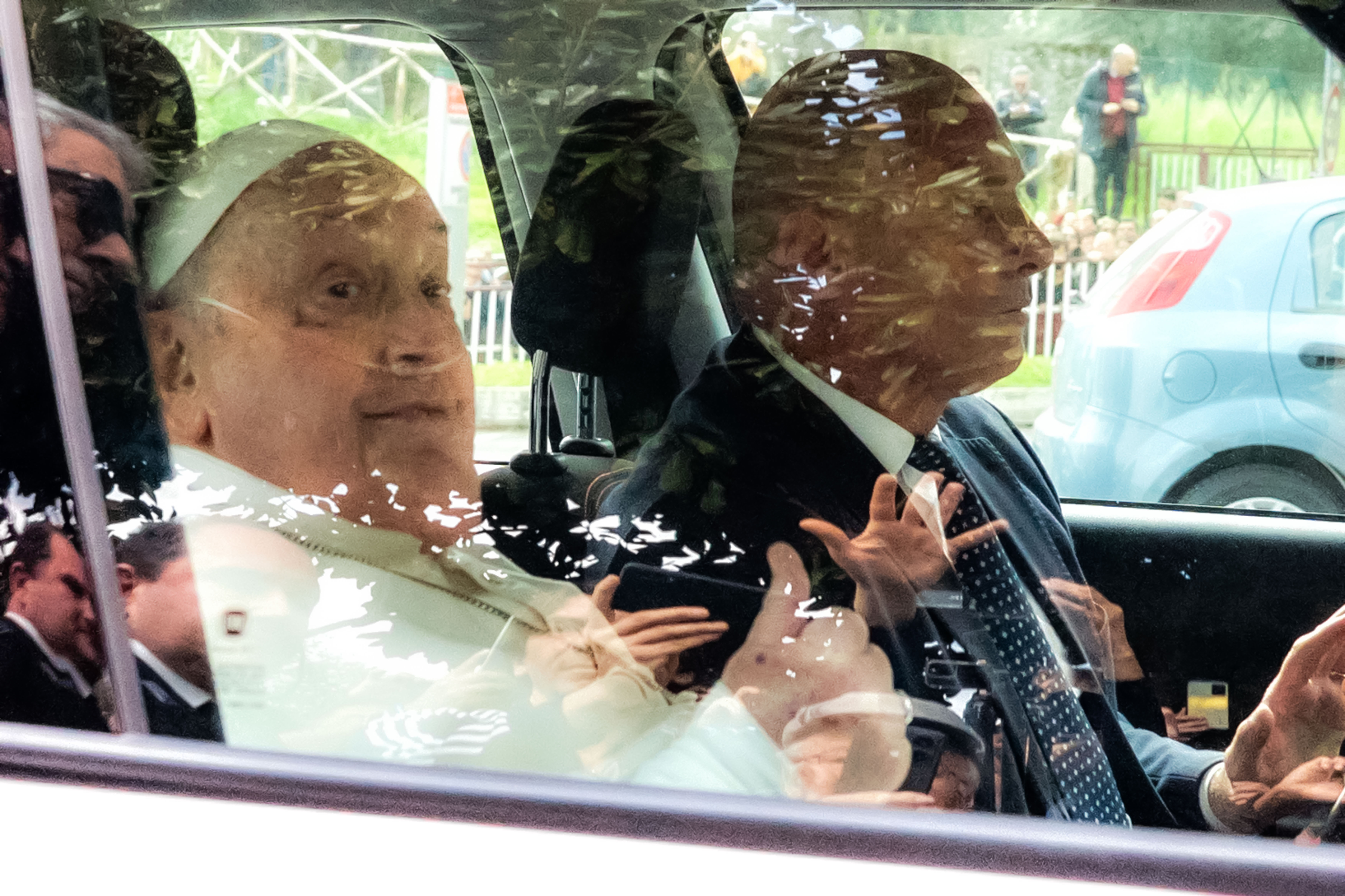 Pope Francis leaves on a car after appearing at a window of the Agostino Gemelli Polyclinic in Rome, Sunday, March 23, 2025, where he has been treated for bronchitis and bilateral pneumonia since Feb. 14. 