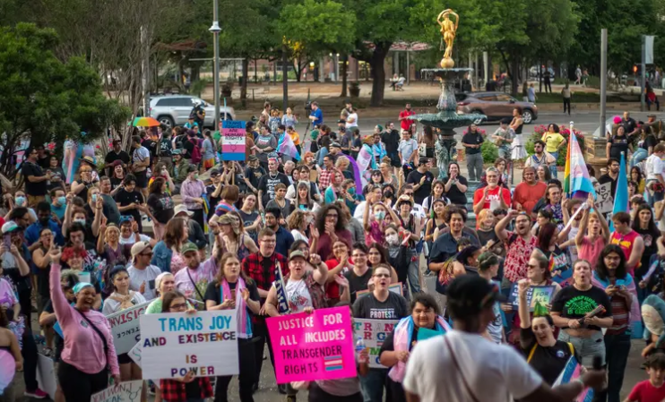 A crowd gathered at a rally for Trans Day of Visibility at the Bexar County Courthouse listens to pediatrician Dr. Lulu in San Antonio in 2023.