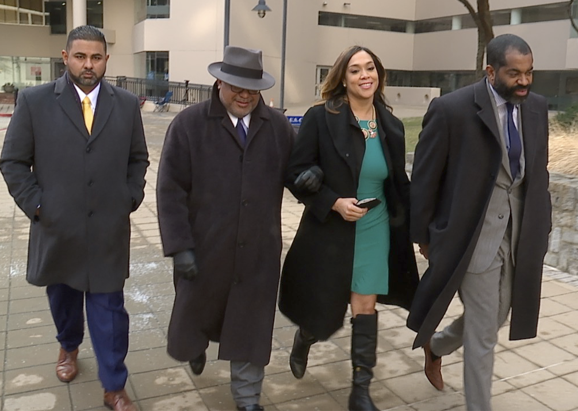  Marilyn Mosby walks out of the federal courthouse with her attorney, A. Scott Bolden, and husband, City Council President Nick Mosby