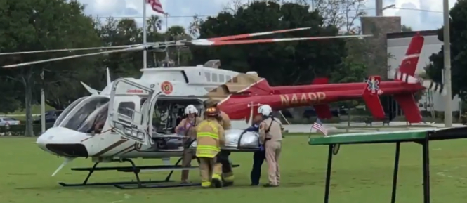 Paramedics load an alligator bite victim into a helicopter at Halpatiokee Regional Park in Stuart on July 19, 2021.jpg