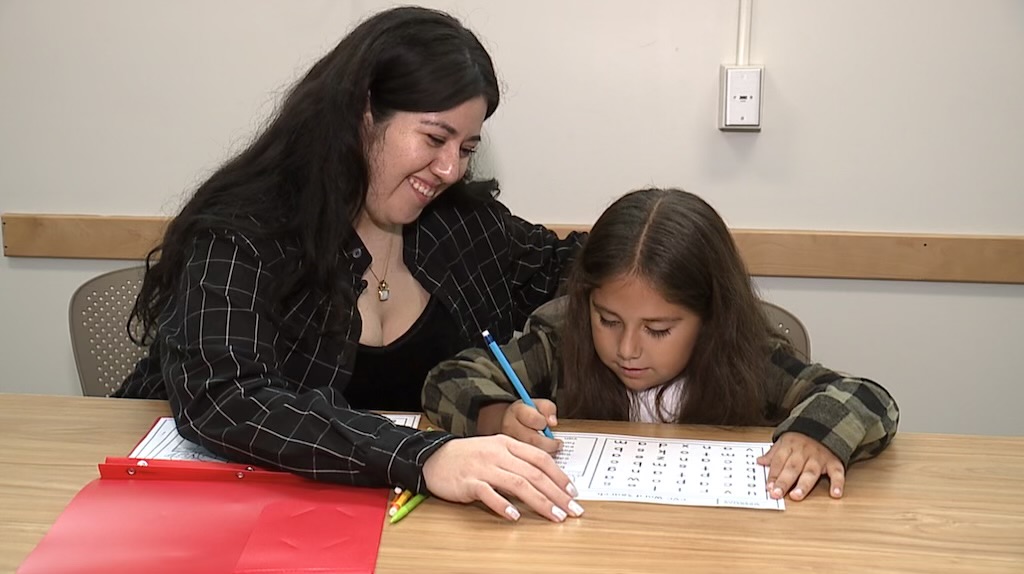 liz and luciano do homework.jpeg