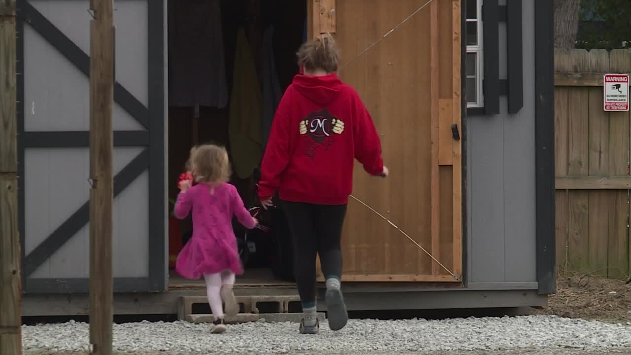 Ricki Moretz and her daughter walk into the Blessings Barn in Sandston, Virginia. 
