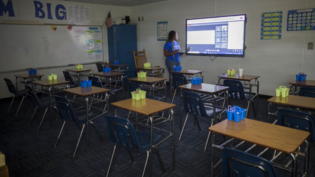 Johnson County Middle School teacher Shaunteria Russell teaches her 7th grade students math from an empty classroom.